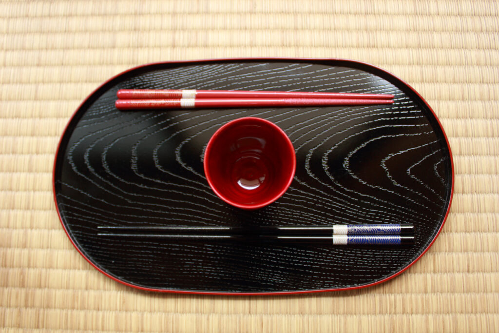 Chopsticks lying on Japanese traditional plate