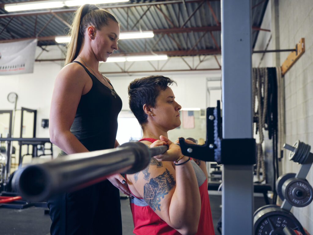Woman Working with a Trainer in a Gym Tattoos in Japan