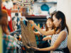 Two female friends shopping in a vintage clothing store in Japan