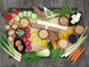 Macrobiotics health food concept with soba and udon noodles, wasabi and miso paste, tofu, vegetables, legumes, grains and seaweed with foods high in protein, antioxidants, vitamins and minerals. On bamboo and marble, top view.