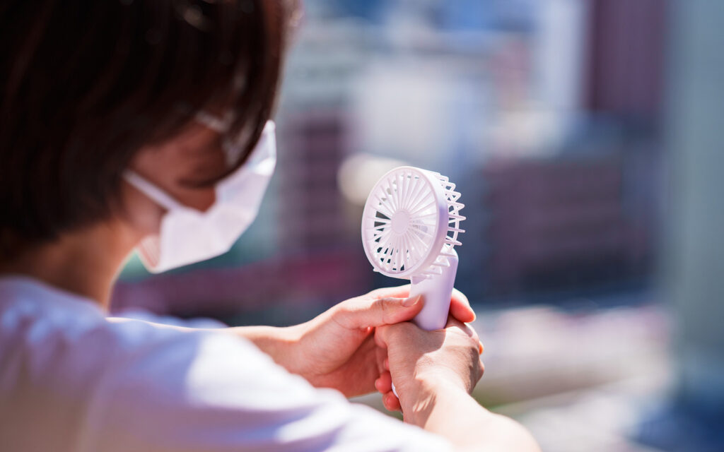 Japanese woman has a handy fan in summer